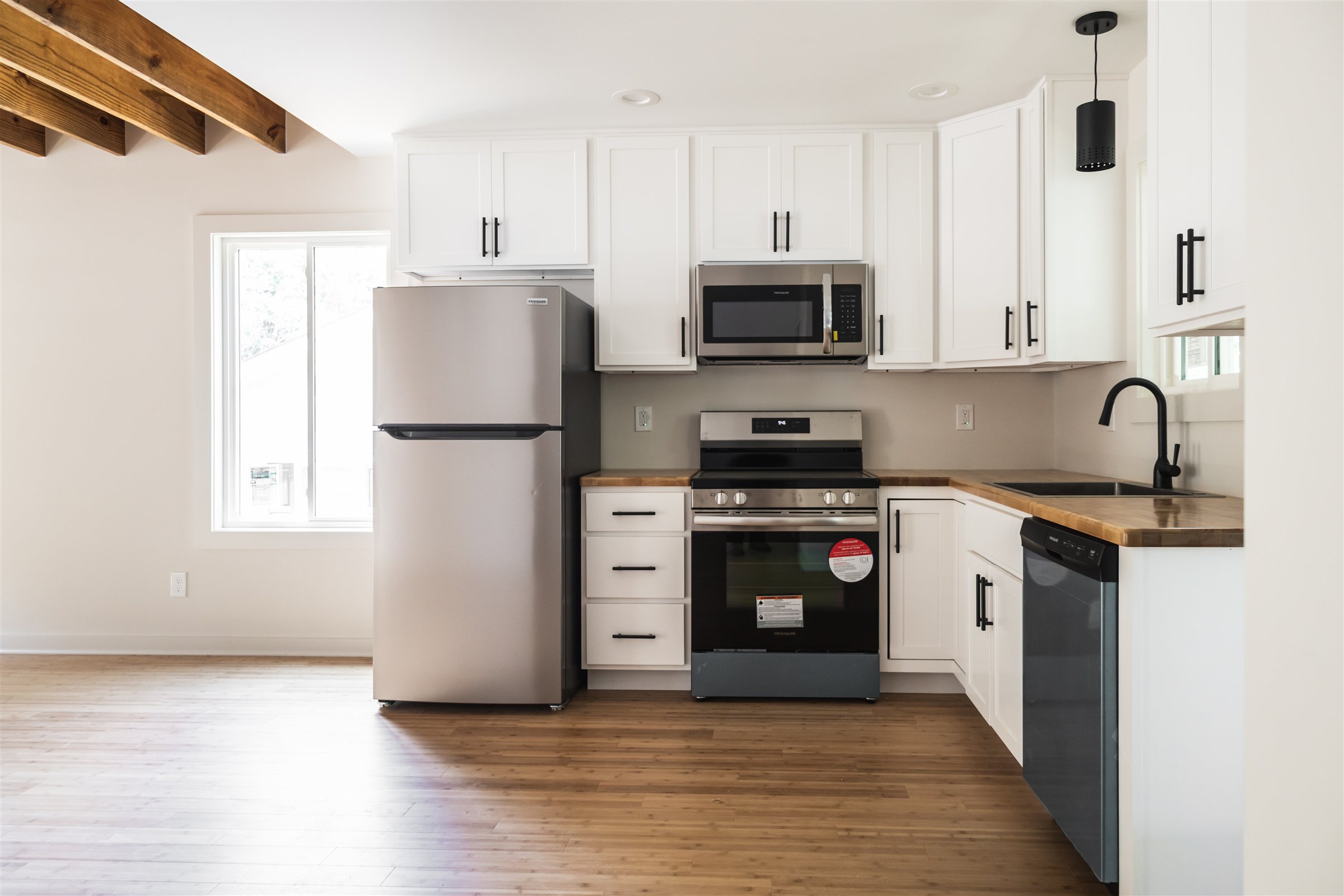 Standard Cottage 3 Bed, kitchen with white cabinets and butcher-block counters